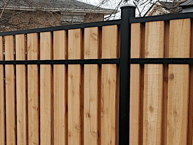 6’ High Slip Fence with Cedar Fence Boards and Aluminum Posts. Shadowbox Style with Approximately 90% Privacy.