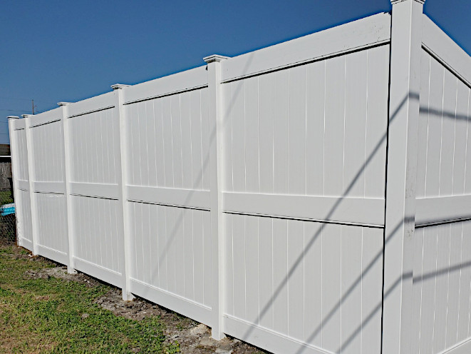 White Privacy Fence Specifically for High Wind-Loads for up to 130 MPH gusts and sustained winds of 75 MPH.