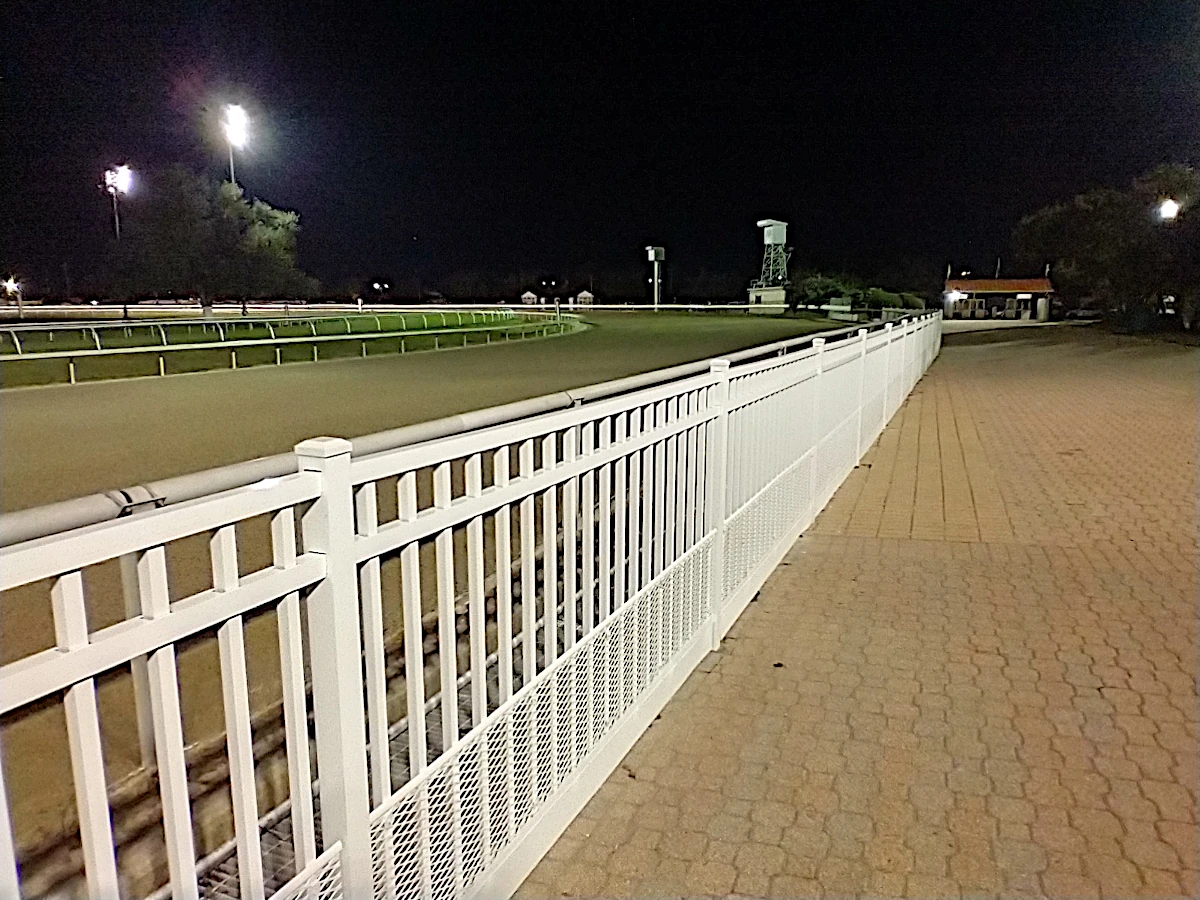 Fairgrounds Race Course. 4-foot-high white aluminum fence, 3-rail, commercial grade. Emily style with flush top and flush bottom.