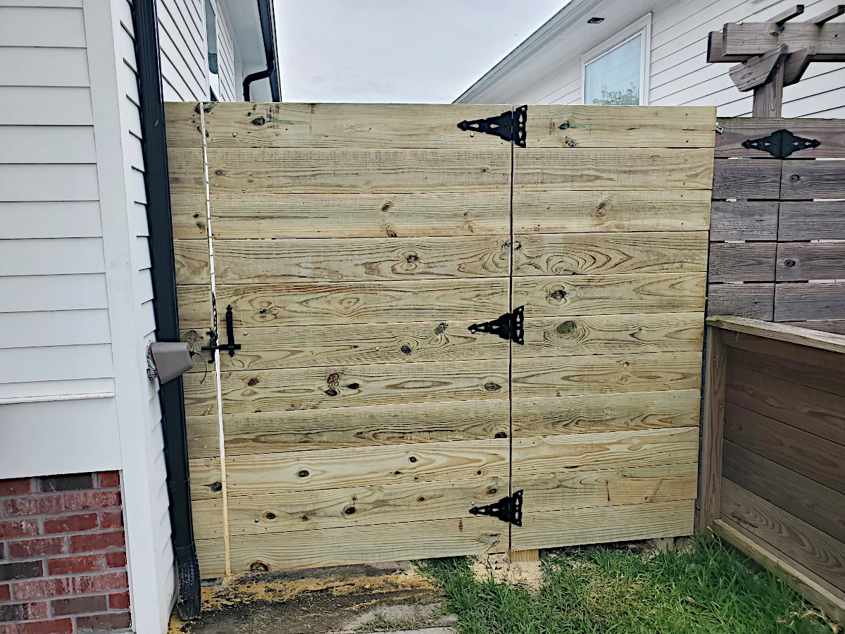 7' high pine horizontal gate using 1" x 8" planks. Planks are not feather-edged. In the Gentilly area, right by City Park.