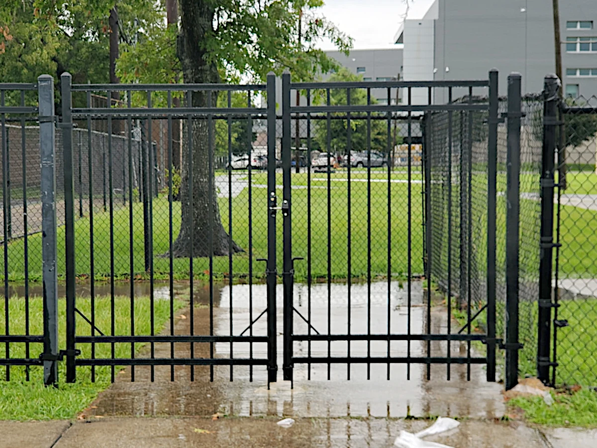 Commercial grade, iron double gate. Black 4-rail with a two-sided locking latch.