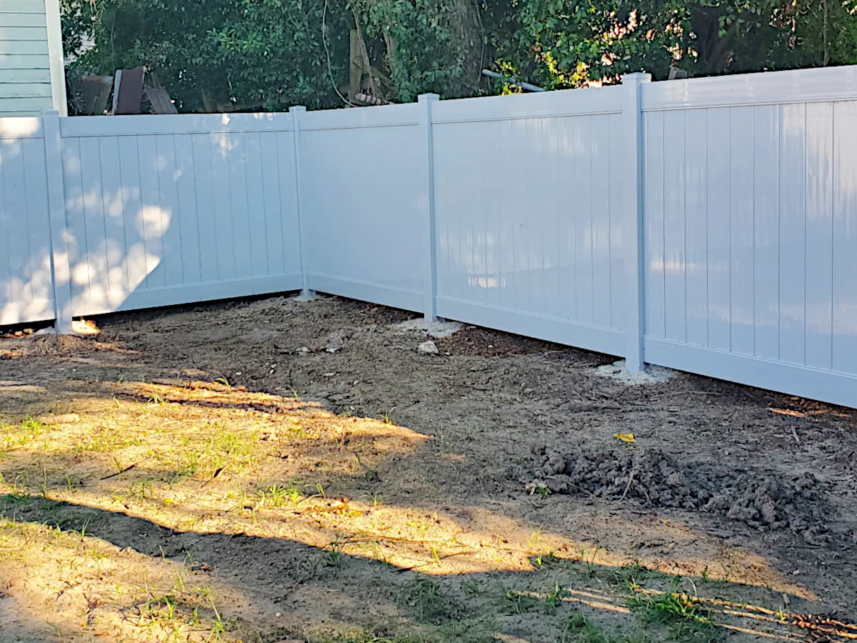 Grey, Vinyl Country Estate privacy fence in the Lakeland series. Installed in New Orleans.