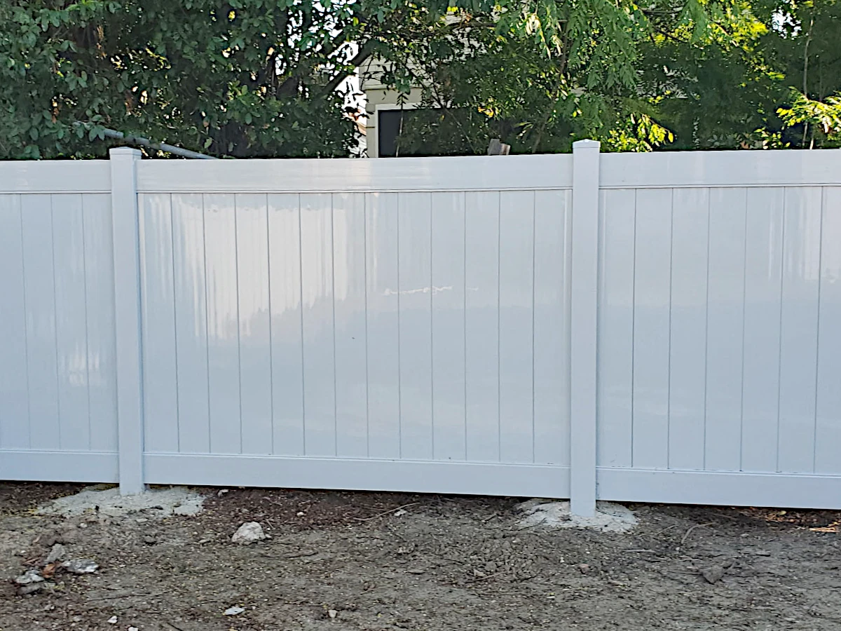 Grey, Vinyl Country Estate privacy fence in the Lakeland series. Installed in New Orleans.