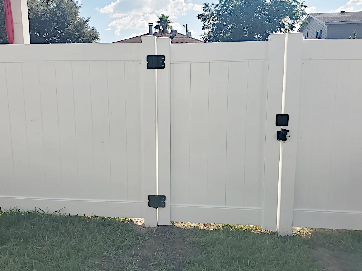 6-foot-high white Country Estate vinyl fence with standard flat top post caps, 2-rail. Lakeland series.